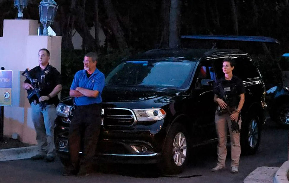 Armed FBI agents guard Mar-a-Lago during 9-hour secretive raid on Monday.