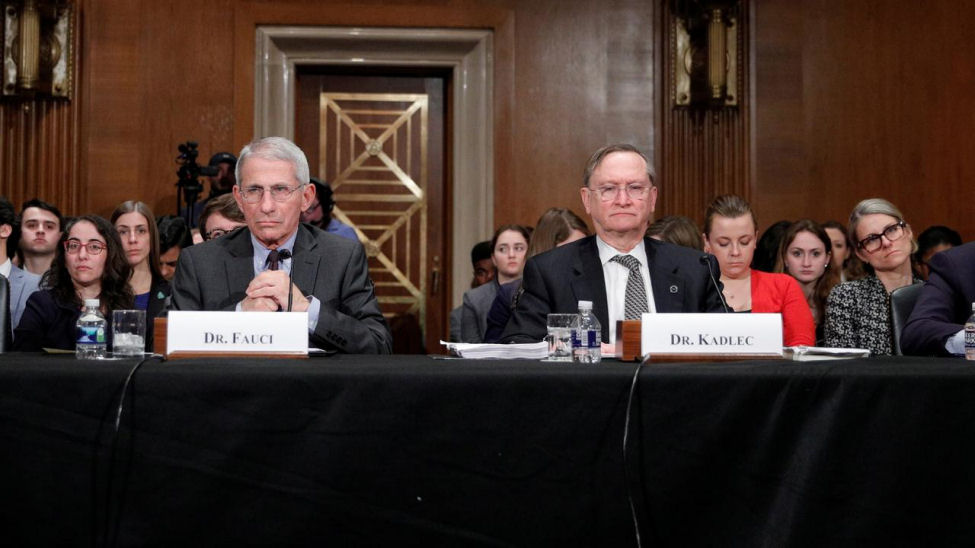 Dr Robert Kadlec, right, and Dr Fauci testify before a Senate Health Committee hearing on the US response to Covid on Capitol Hill on March 3, 2020